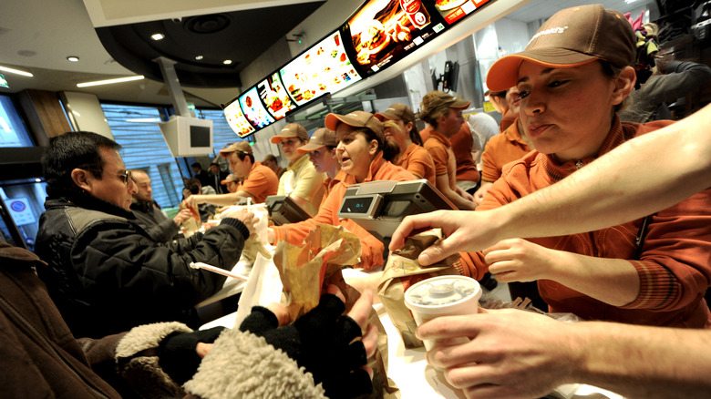 McDonald's workers serving customers
