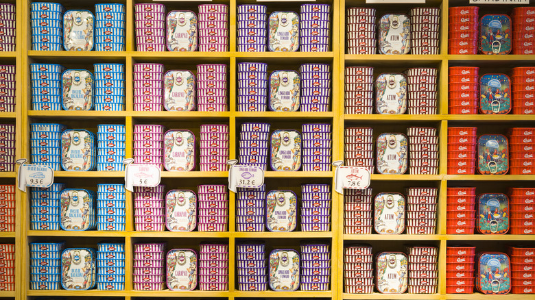 shelves of tinned fish, brightly colored tins