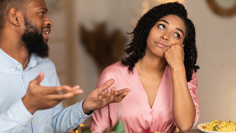 man annoying bored woman