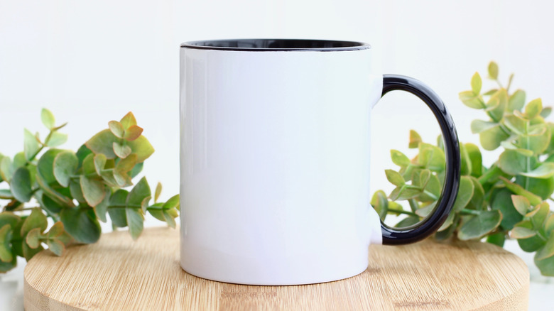 White mug on wooden board