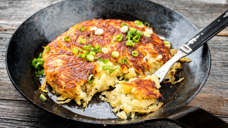 Fork scooping hash browns