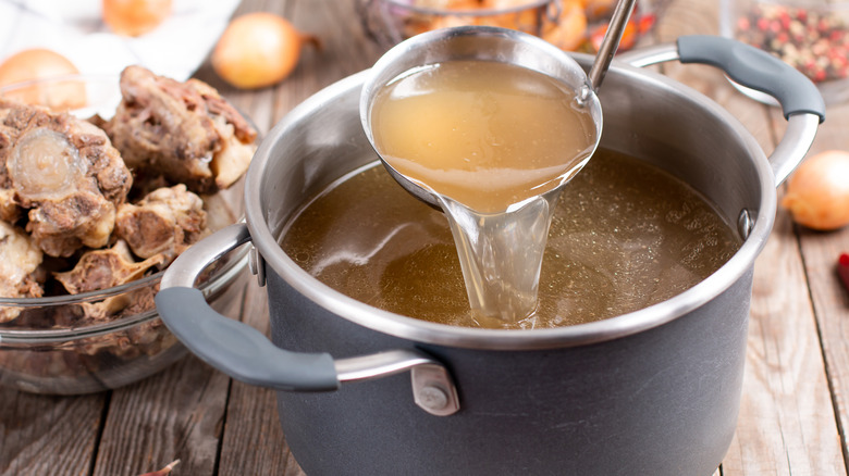 pot of broth with ladle