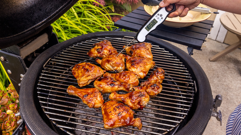 meat thermometer in grilled chicken