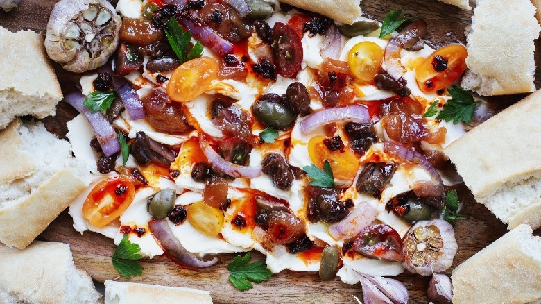 Butter board with tomatoes and olives