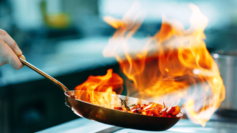 flambe pan with flames