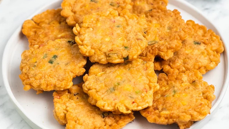 corn fritters on white plate