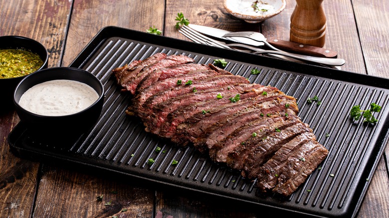 sliced flank steak on grill