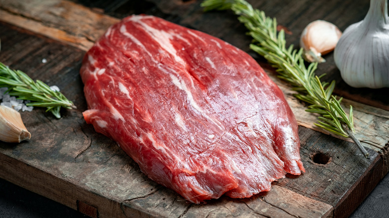 raw flank steak cutting board