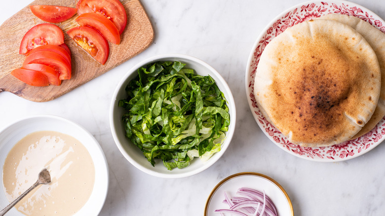 ingredients gathered for falafel sandwiches