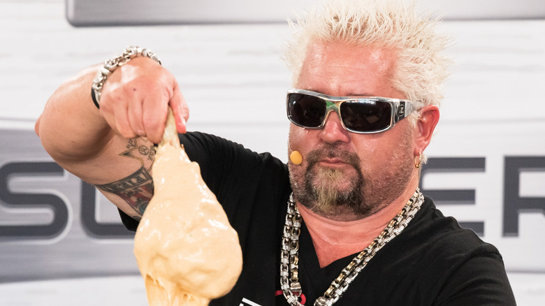 Guy Fieri battering some food