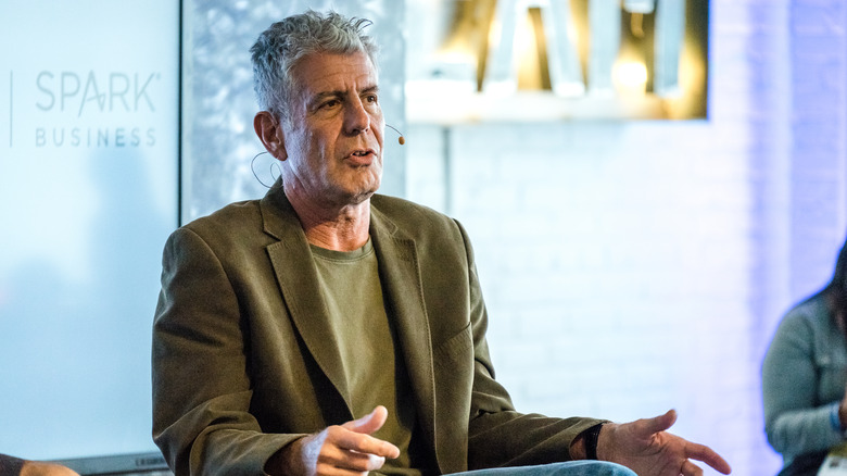 Anthony Bourdain in a green jacket