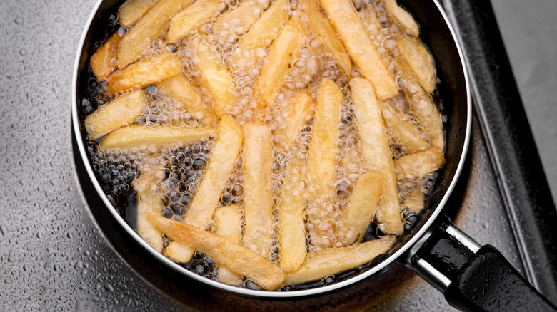 French fries cooking in oil