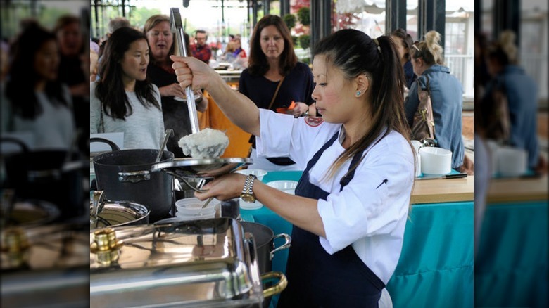 Chef Mei Lin serving food