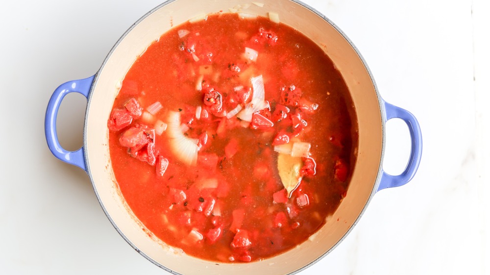vegetable broth in dutch oven with tomatoes
