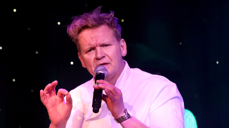 Gordon Ramsay talking into a mic looking serious 