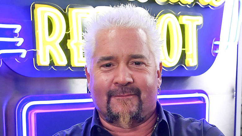 Guy Fieri with his arms crossed 