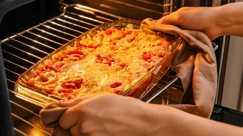 Removing casserole from oven