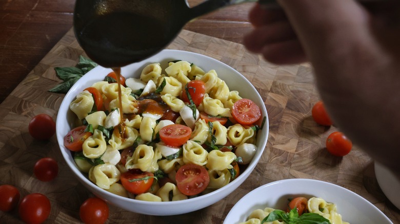 drizzling vinaigrette over pasta salad