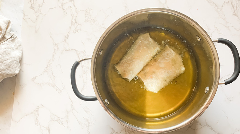 burritos in pot of oil