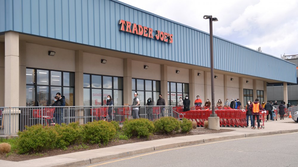 Shoppers wait to enter a Trader Joe's