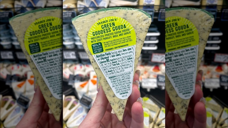 Person holding Trader Joe's Green Goddess Gouda