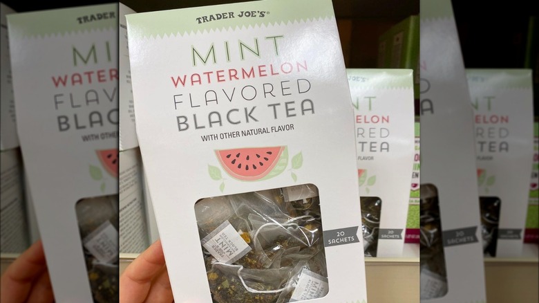 A hand holding Trader Joe's new tea