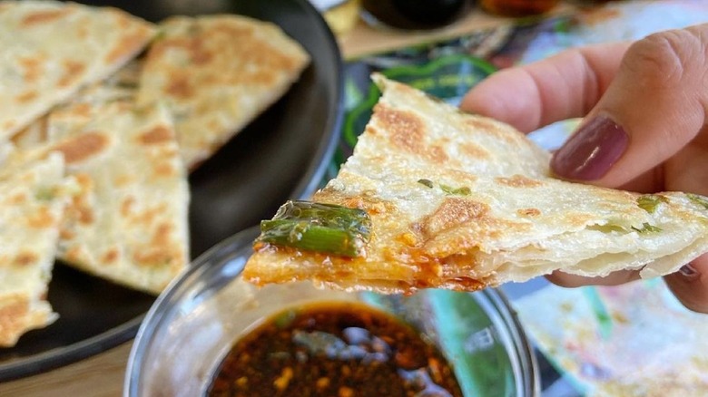 Green onion pancake in hand