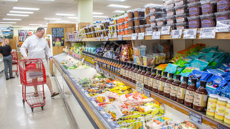 Person shopping in Trader Joe's aisle