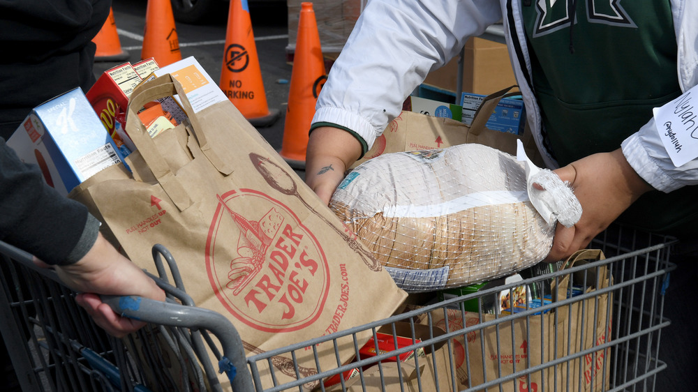 Trader Joe's employee loading cart