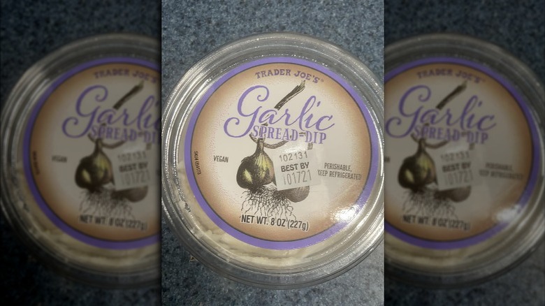 A container of garlic spread dip from Trader Joe's