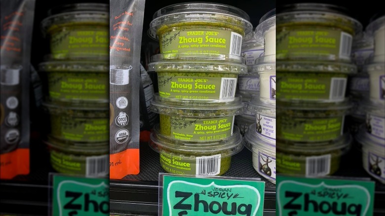 Several containers of green Zhoug sauce from Trader Joe's