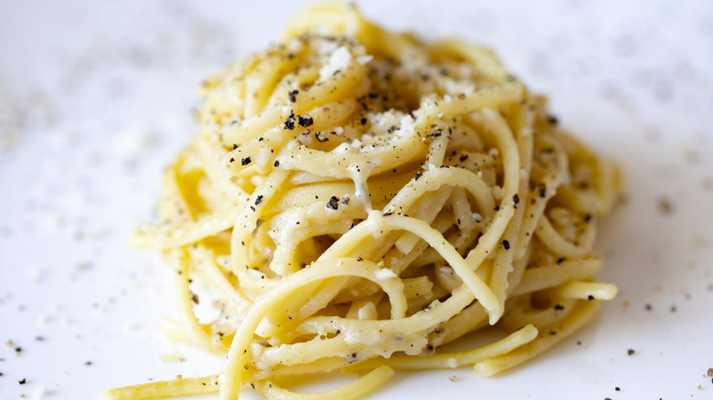 Pasta noodles with salt and pepper