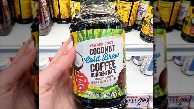 Someone holding a bottle of Trader Joe's Coconut Cold Brew Coffee