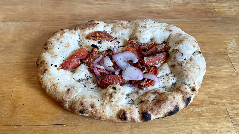 baked focaccia with onions and tomato