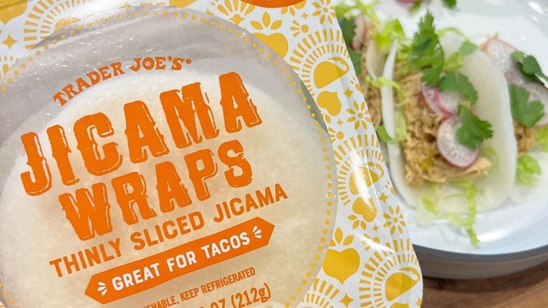 Jicama wrap with tacos in the background