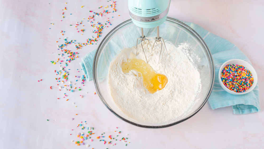 adding egg into dry ingredients