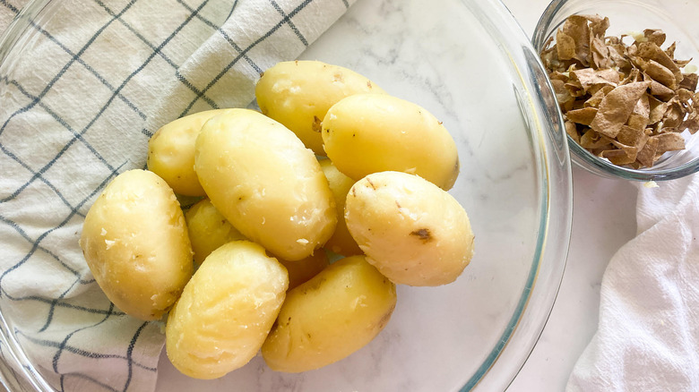 peeled potatoes in a bowl