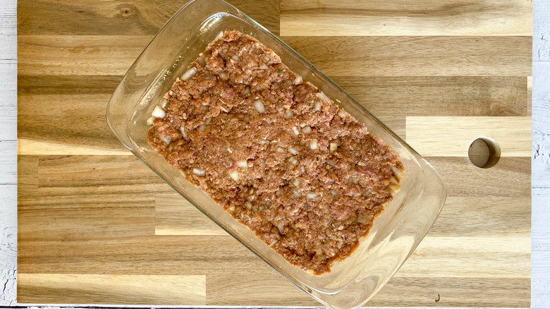 uncooked meatloaf in pan