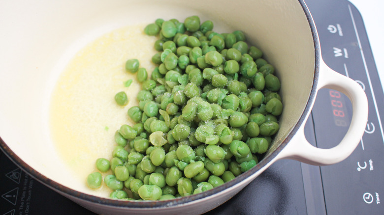 peas cooking in butter