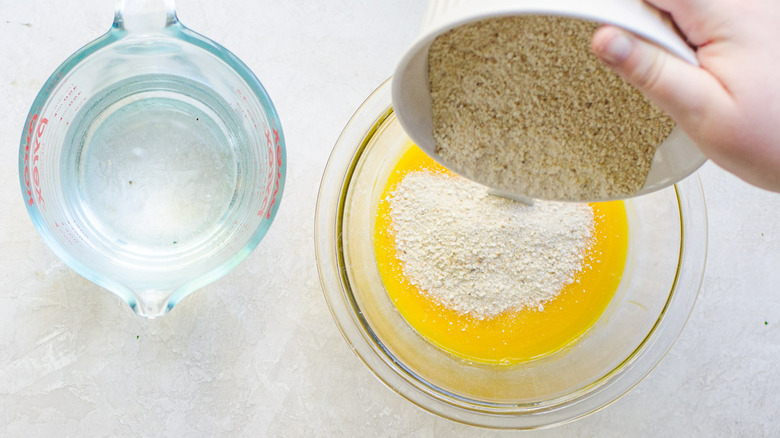 pouring matzo meal into bowl