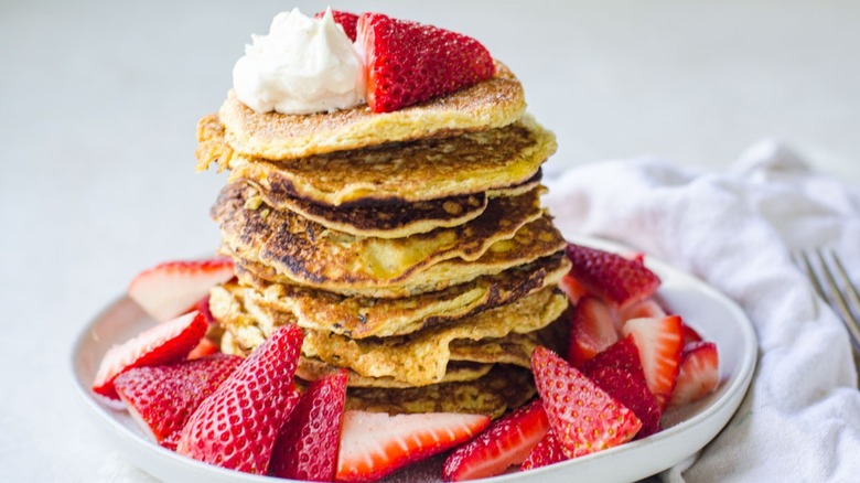 stacked pancakes with strawberries