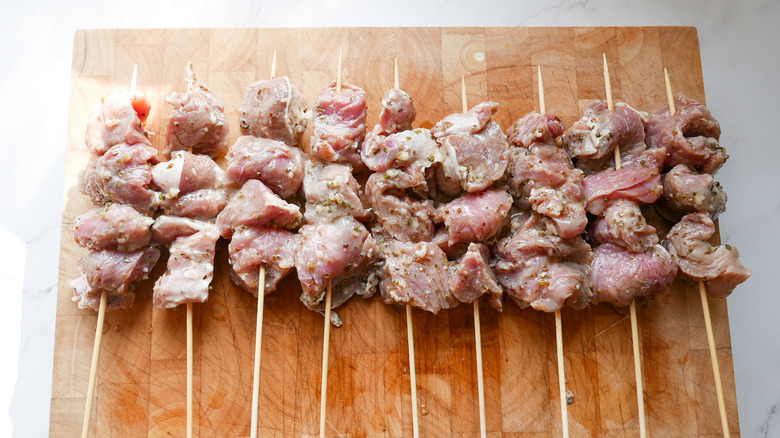 Pork on wooden skewers