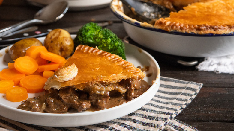 Steak and kidney pie with vegetables