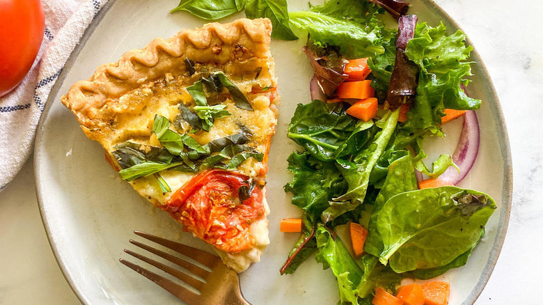 slice of tomato pie with salad