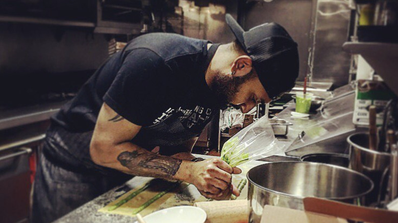 Ashish Alfred working in restaurant kitchen