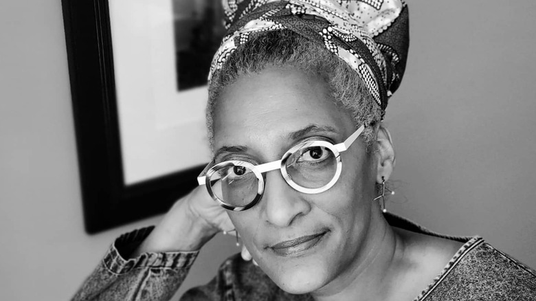 Black and white photo of Carla Hall with hair wrap