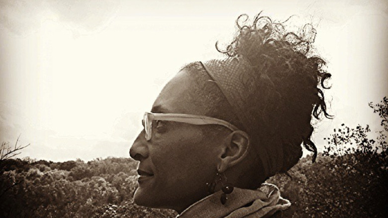 Black and white photo of Carla Hall side profile