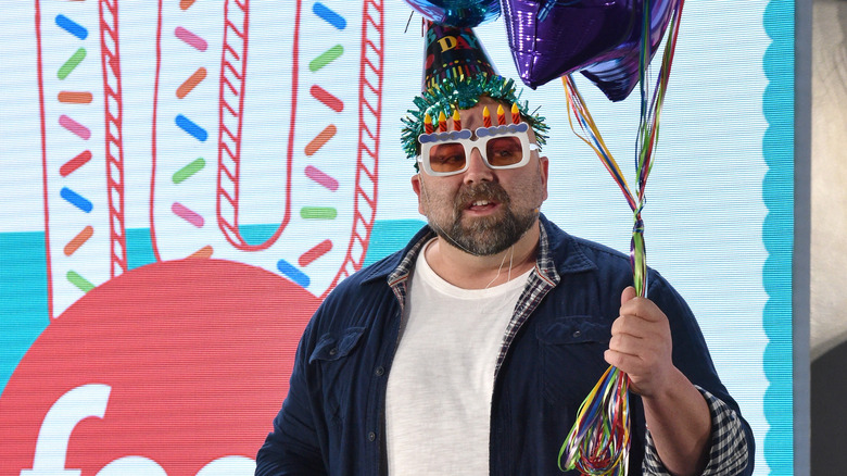 Duff Goldman holds balloons