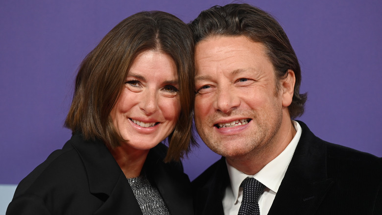 Jamie Oliver smiles with wife Jools