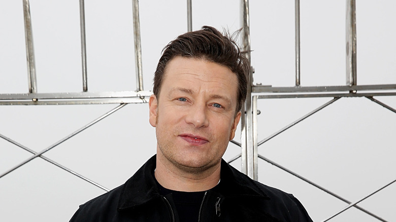 Jamie Oliver smiling with white background